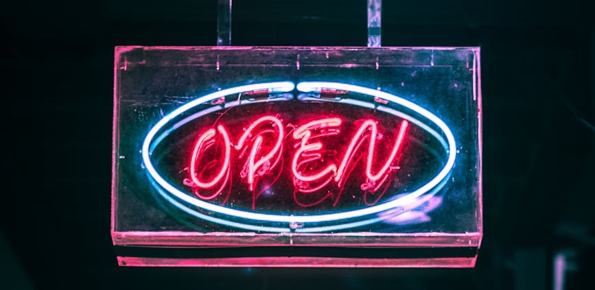 open neon signage turned on